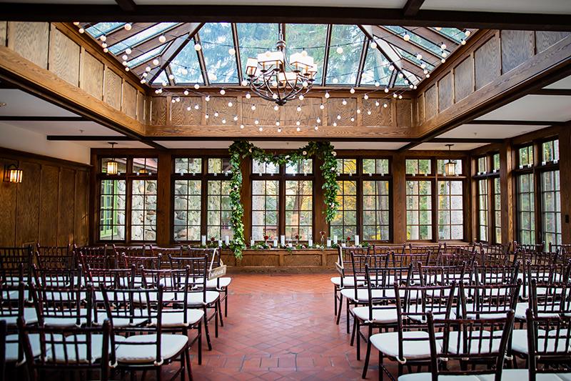 A conservatory set up for a wedding ceremony