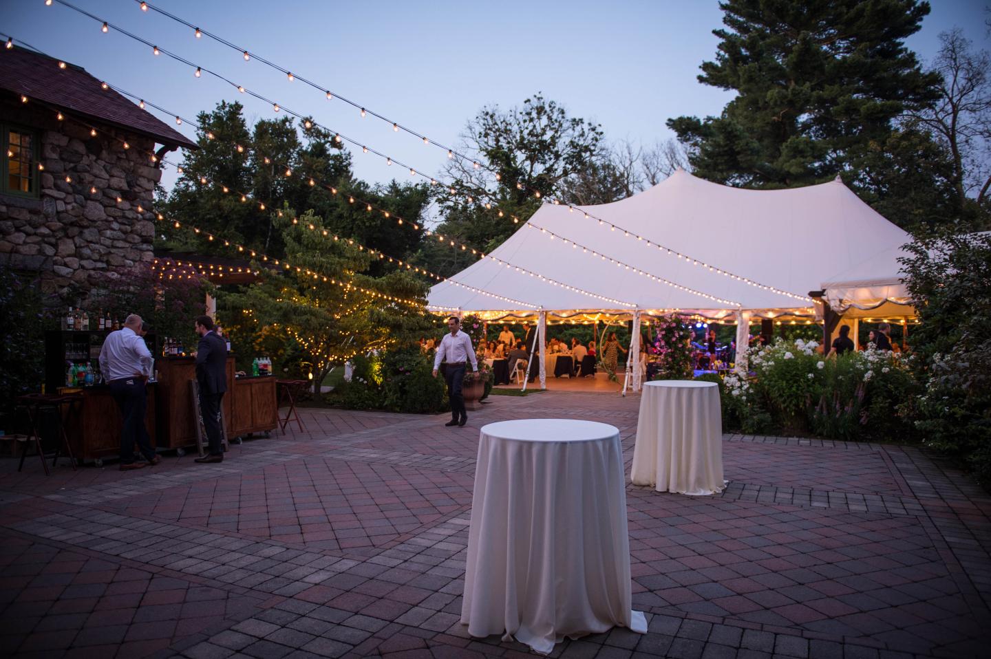 A tent wedding at dusk
