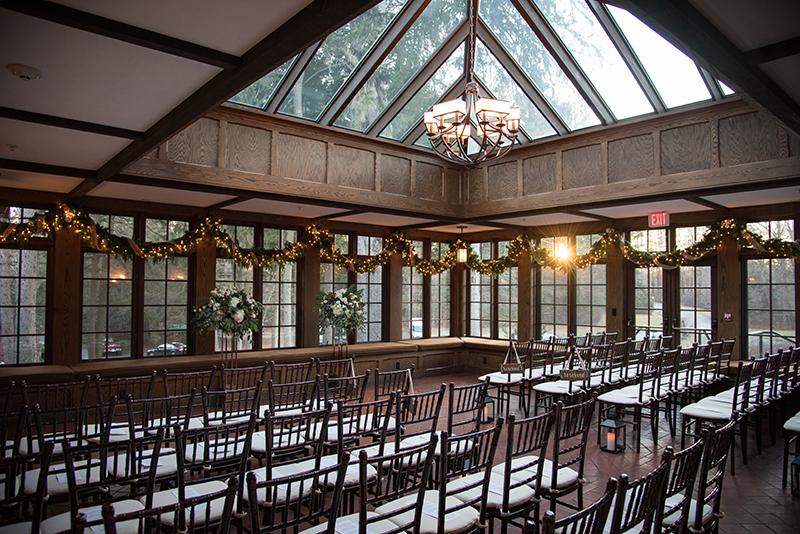 A conservatory set up for a wedding ceremony