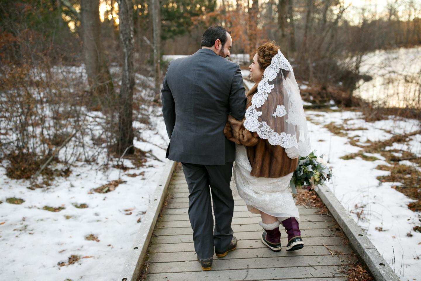 couple in the snow on wedding day