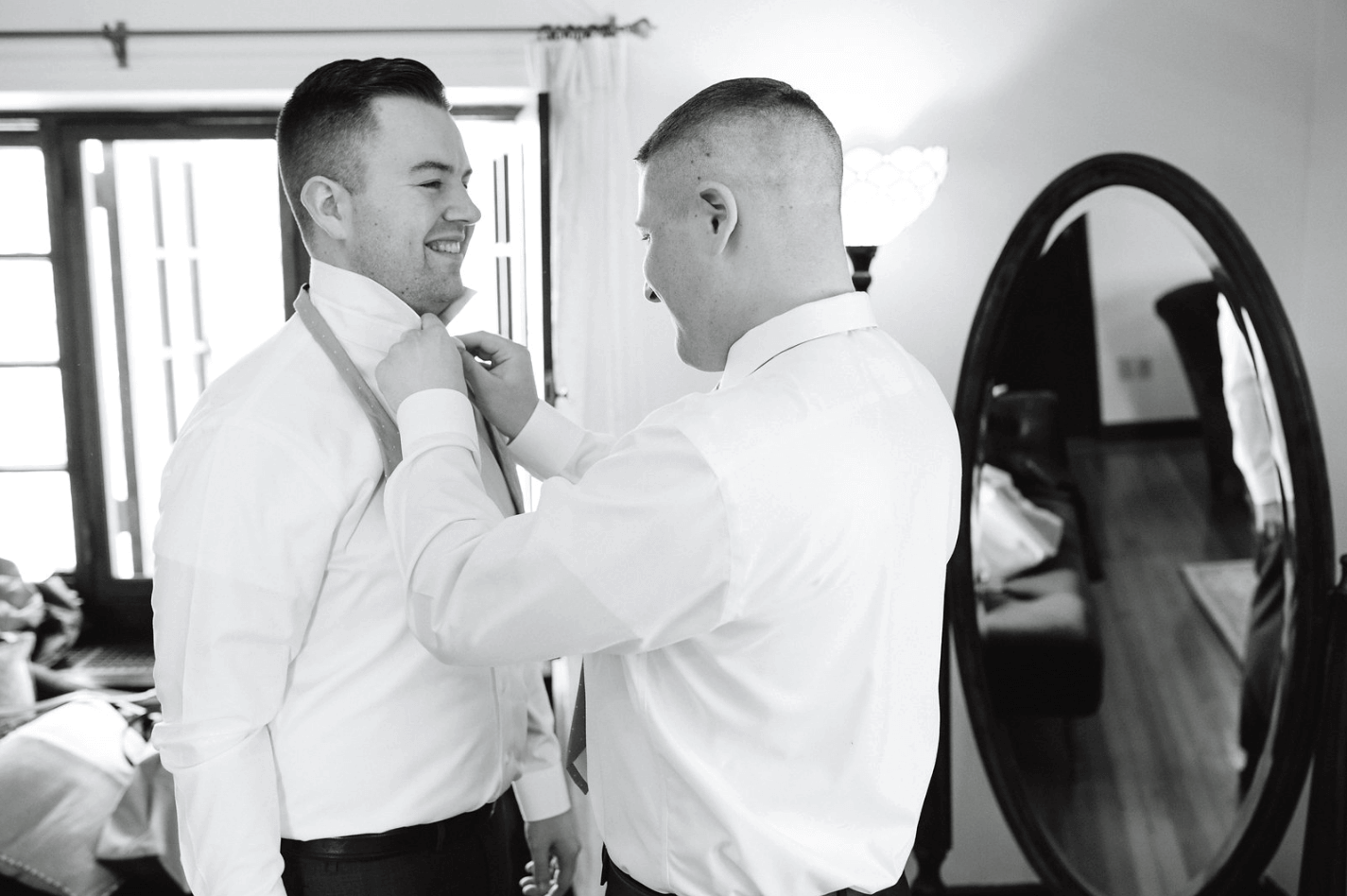 Two grooms getting ready