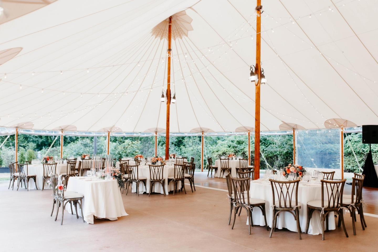 A tent set up for a wedding reception