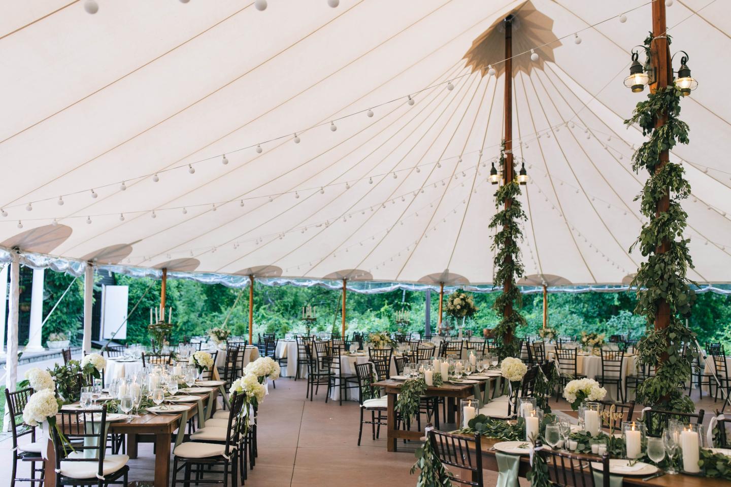 A tent set up for a wedding reception