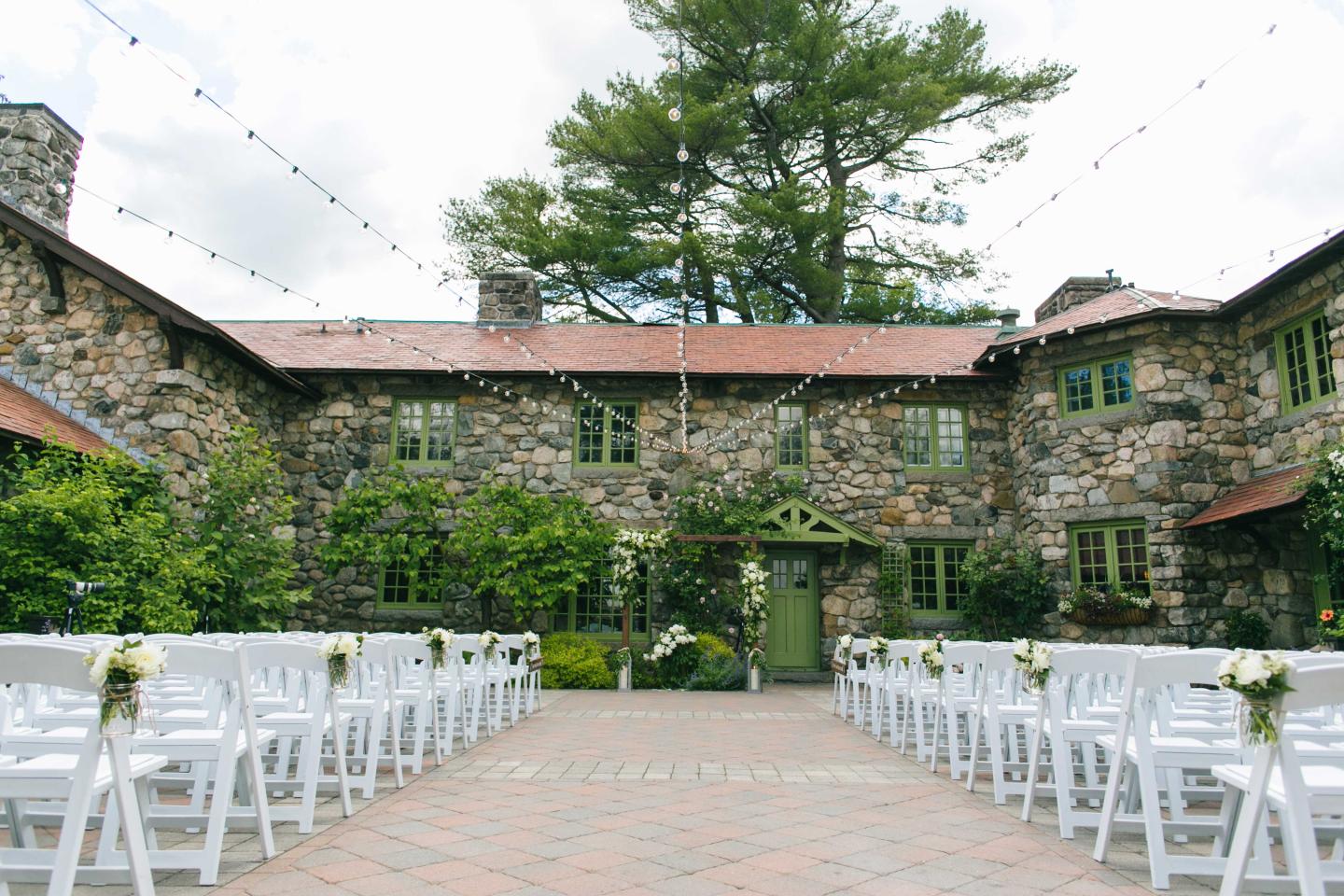 A courtyard set up for a wedding ceremony