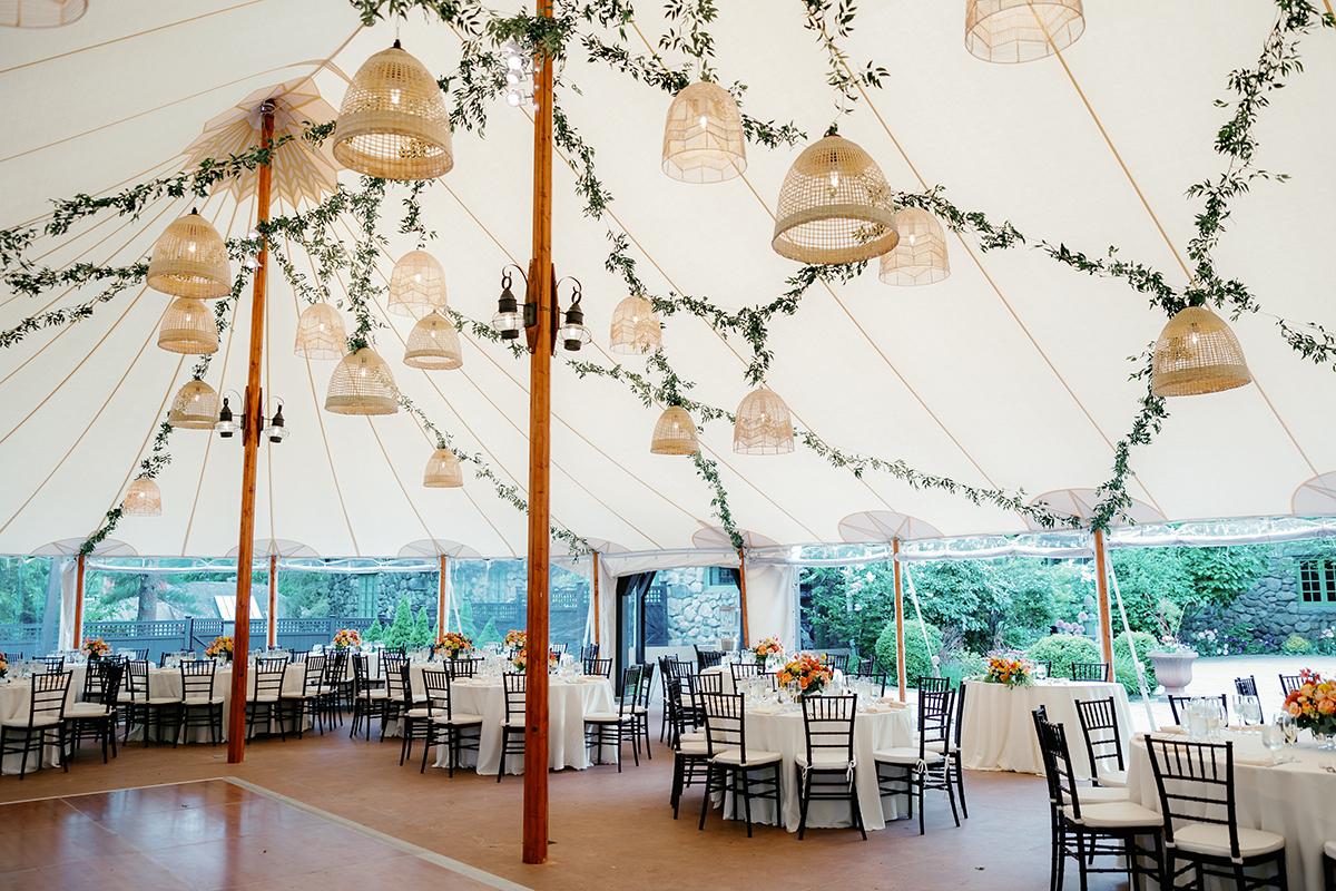tent reception with hanging lanterns