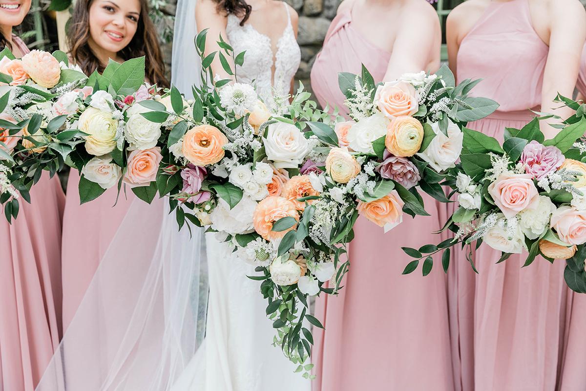 bridesmaids with flower bouquets