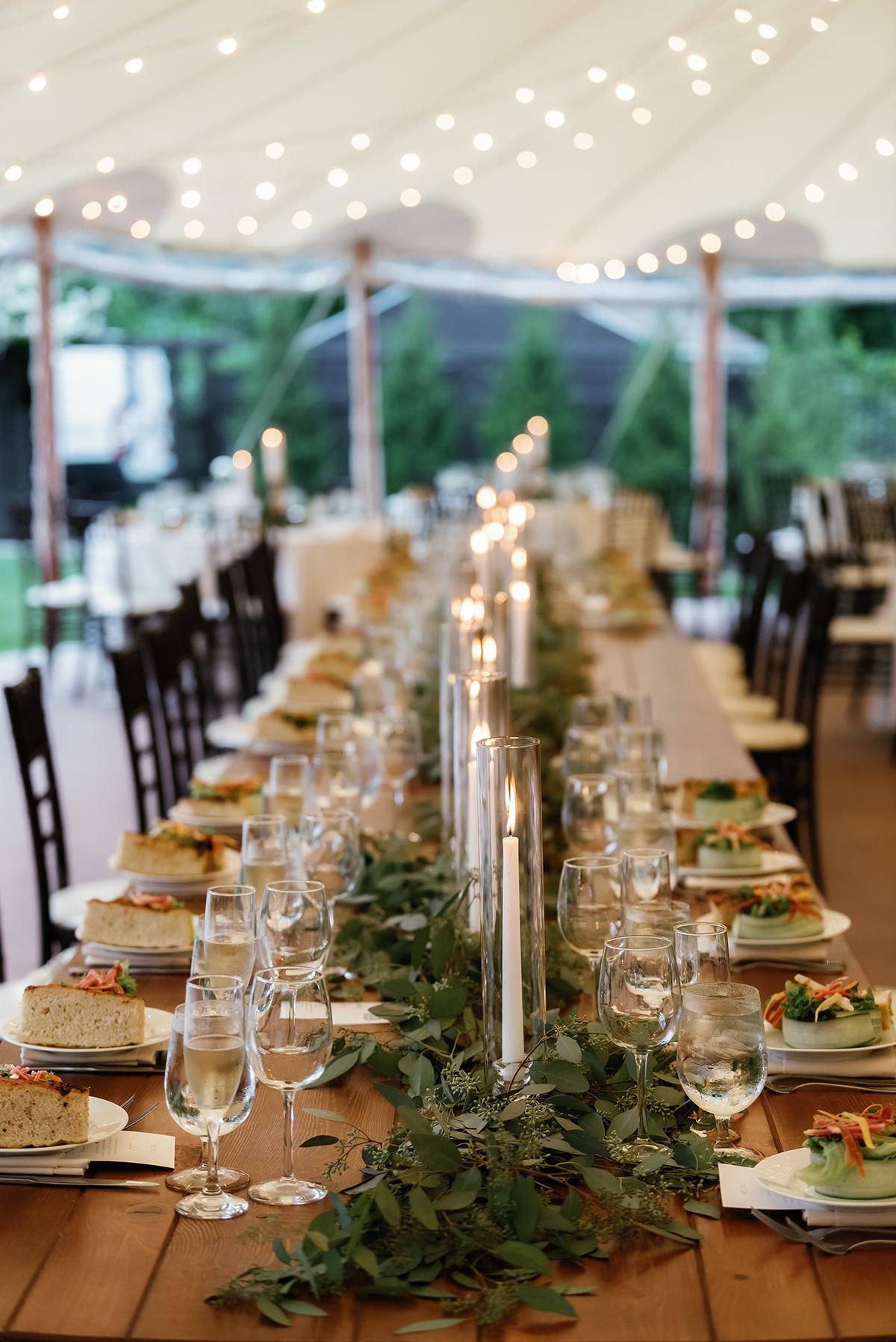 tablescape with candles and greenery