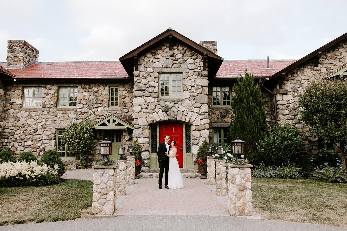 couple front of house