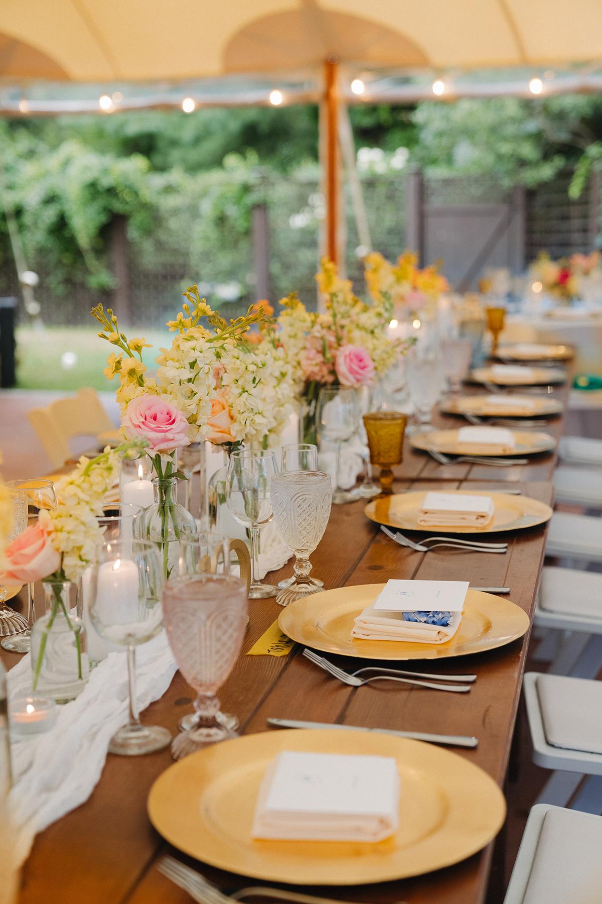 pastel tablescape with gold chargers