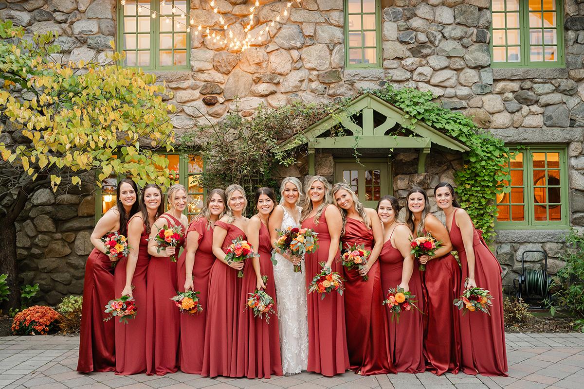 bridesmaids in red dresses and bright florals