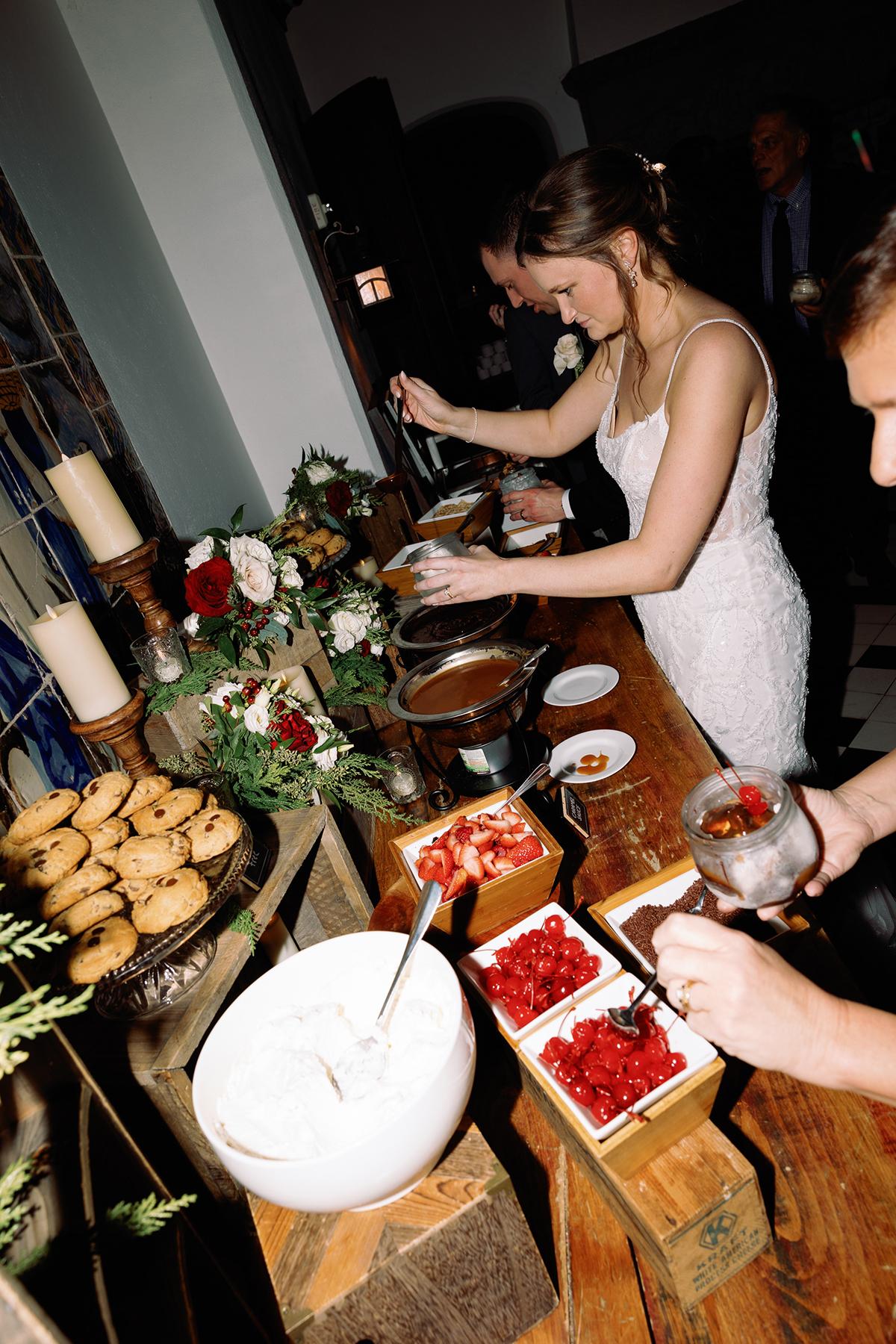 Buffet table with desserts, a person in formal attire serving.