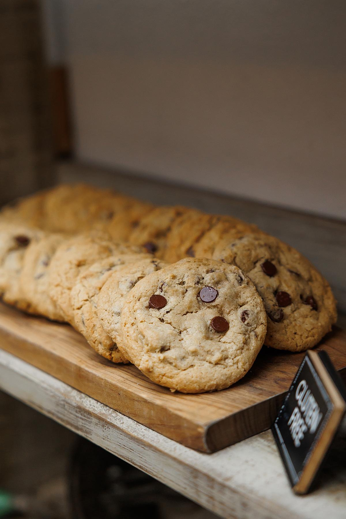 Chocolate chip cookies on a wooden board.